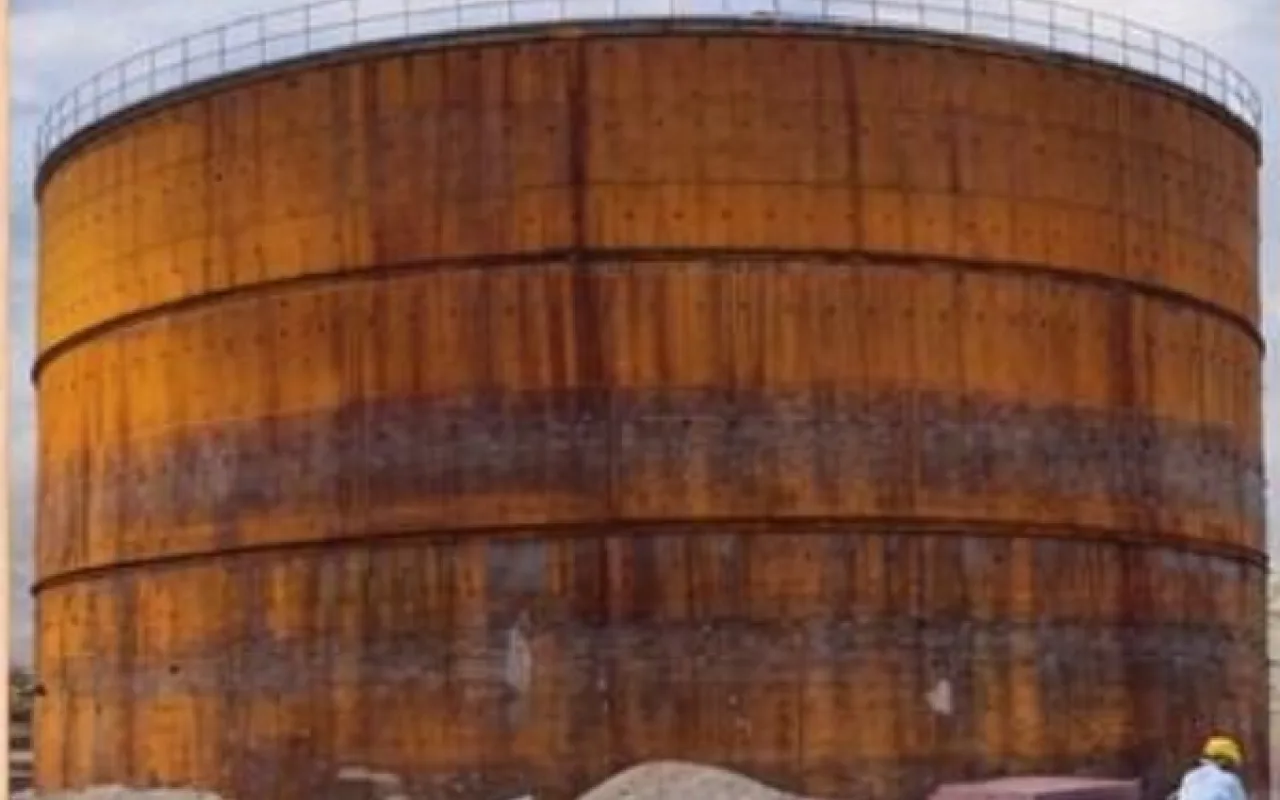 Corroded molasses tank before treatment